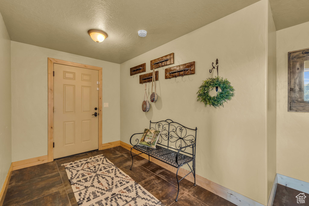 Foyer with a textured ceiling