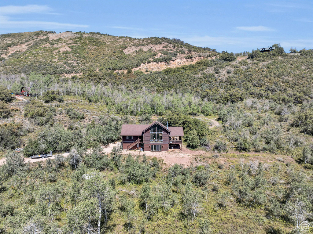 Birds eye view of property with a mountain view