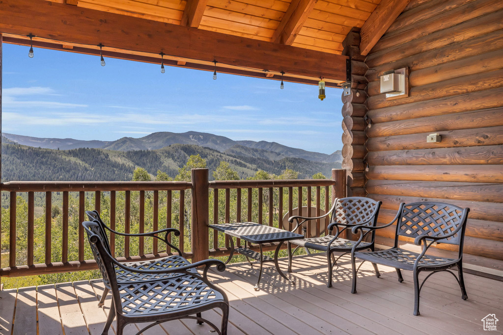 Wooden terrace featuring a mountain view