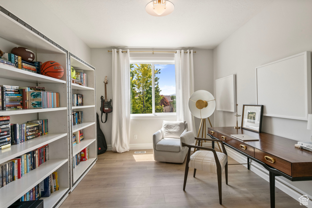 Office space with light wood-type flooring