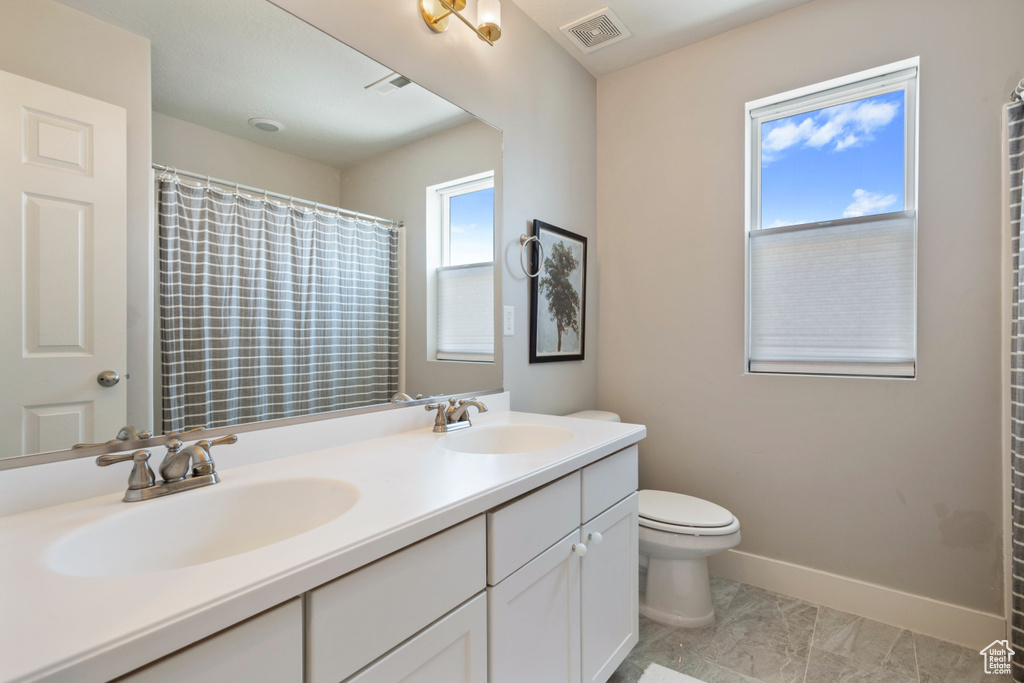 Bathroom with vanity and toilet