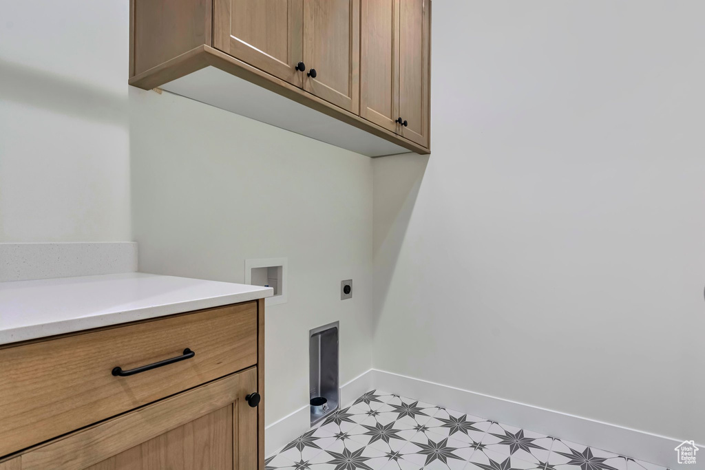 Laundry room featuring washer hookup, cabinets, and electric dryer hookup