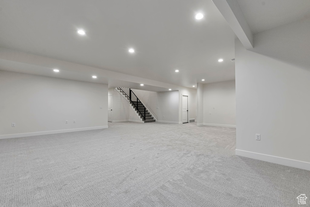 Basement with light carpet