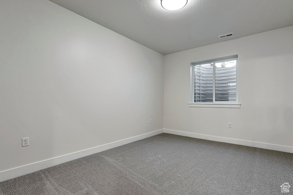 Empty room featuring carpet