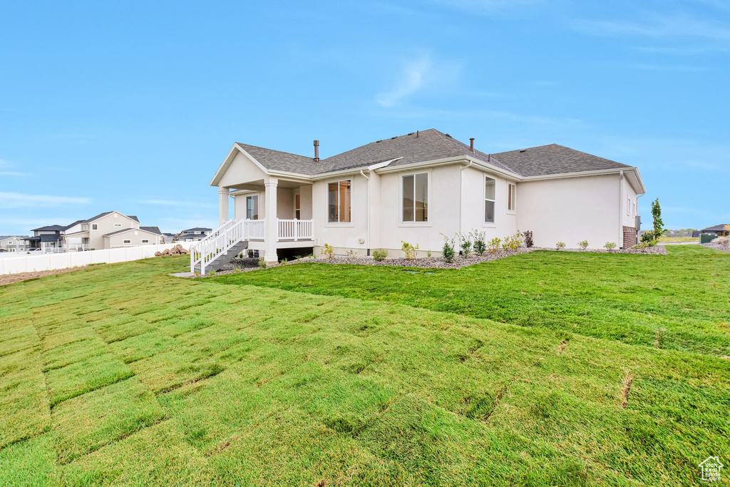 Exterior space featuring a yard