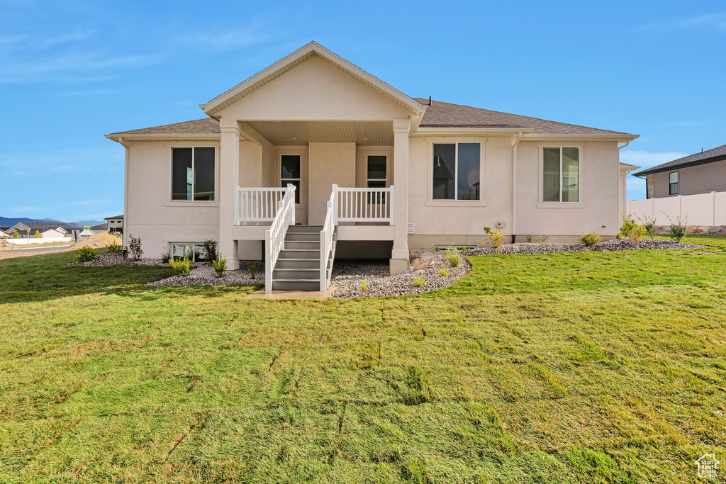 View of front of property with a front lawn