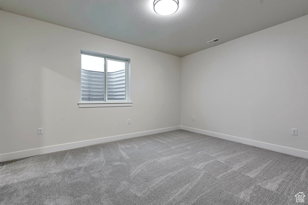 Empty room featuring carpet floors