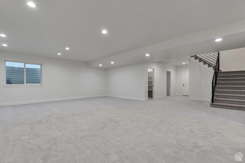 Basement with light carpet