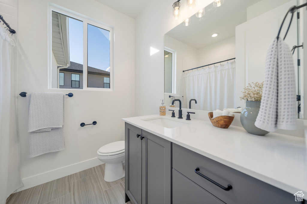 Bathroom with toilet and vanity