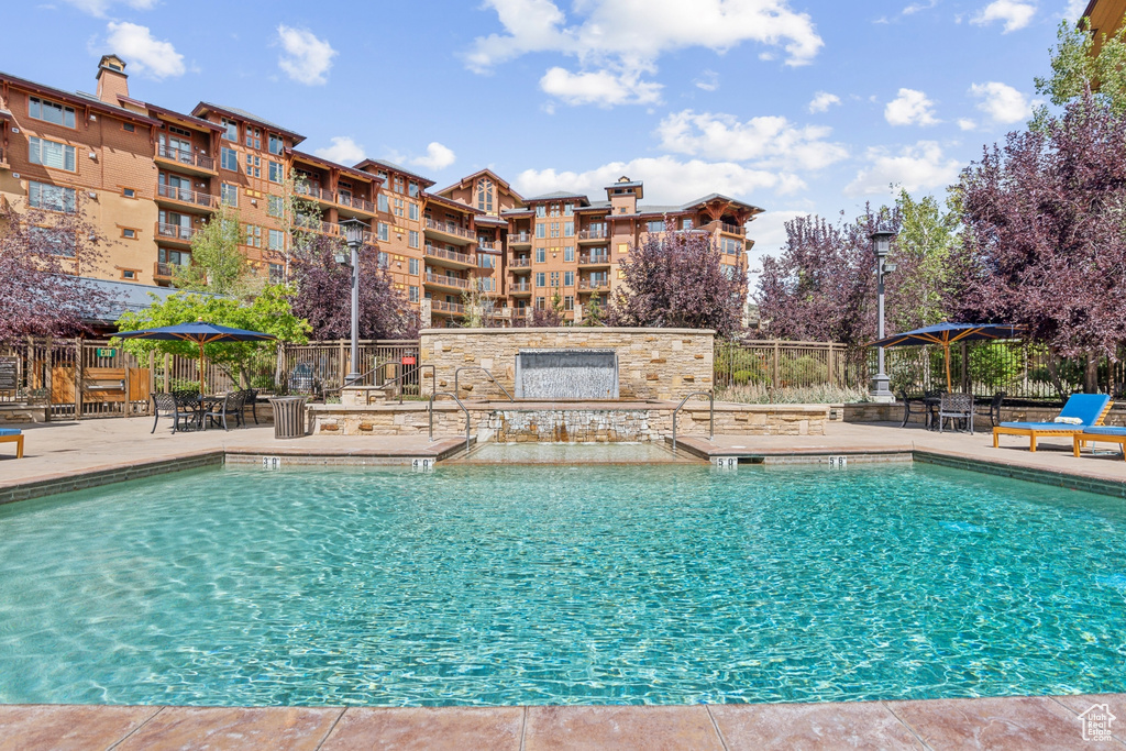 View of swimming pool with a patio area and a gazebo