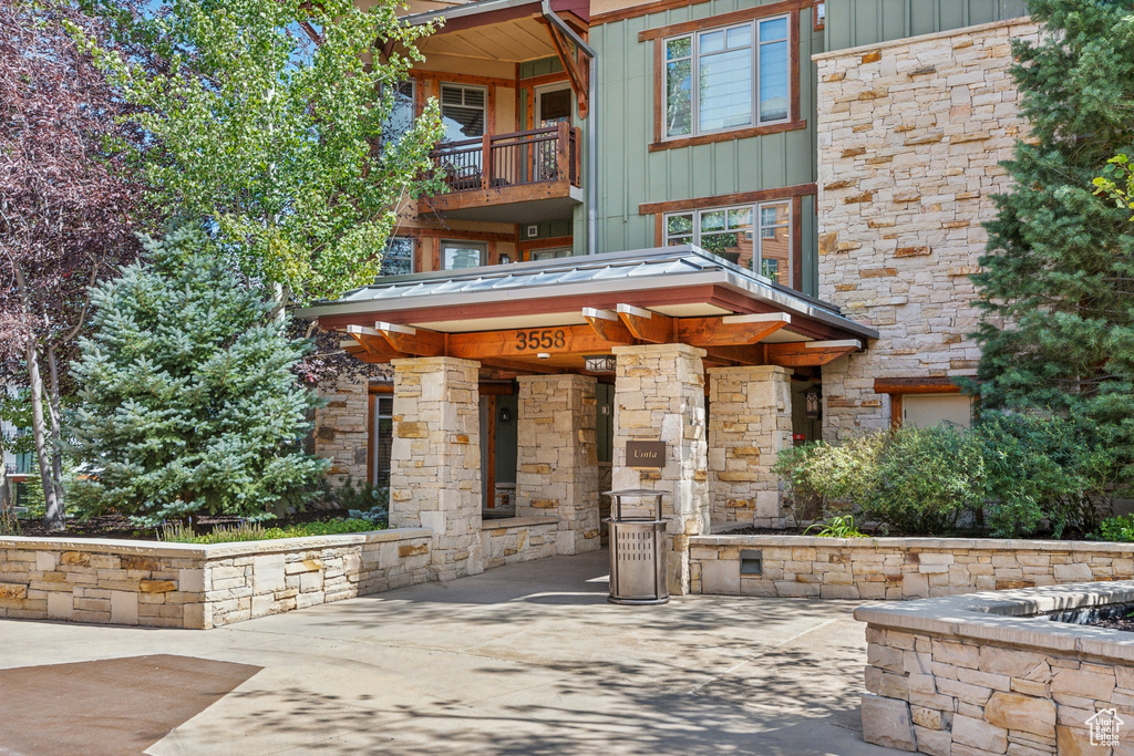 View of community with a fire pit and a patio area