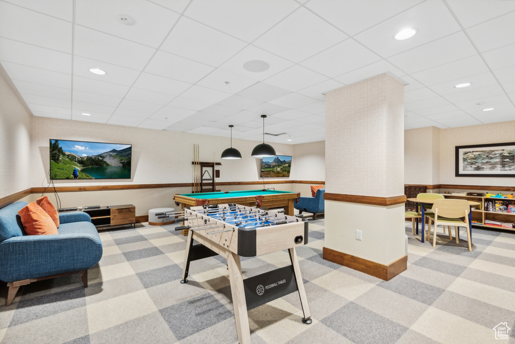 Game room with light carpet, a paneled ceiling, and pool table