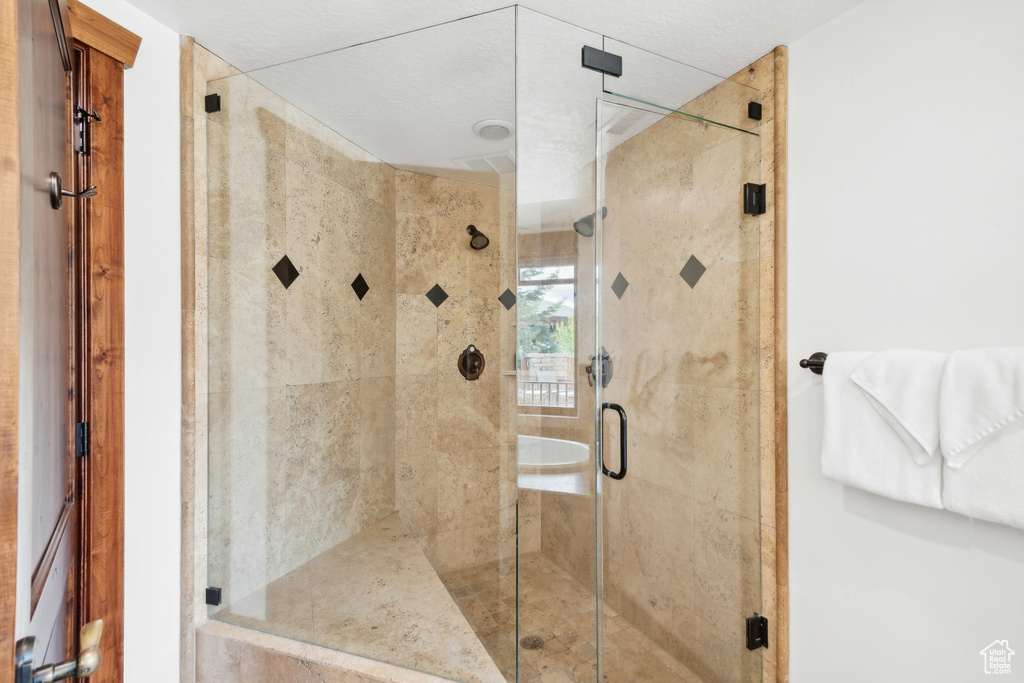 Bathroom with a shower with shower door