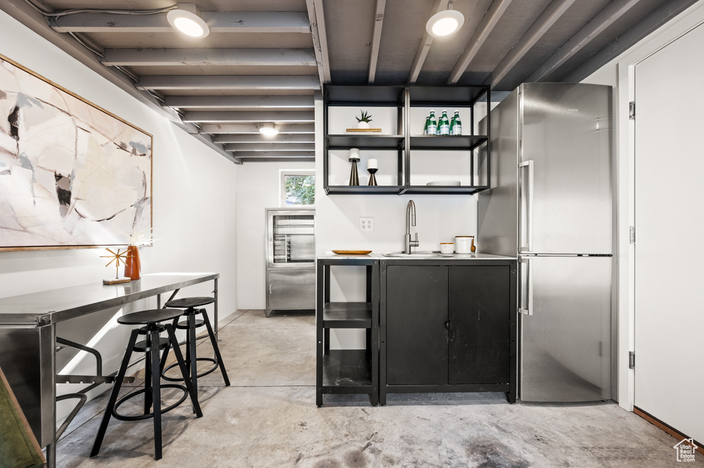 Kitchen with high end refrigerator and sink