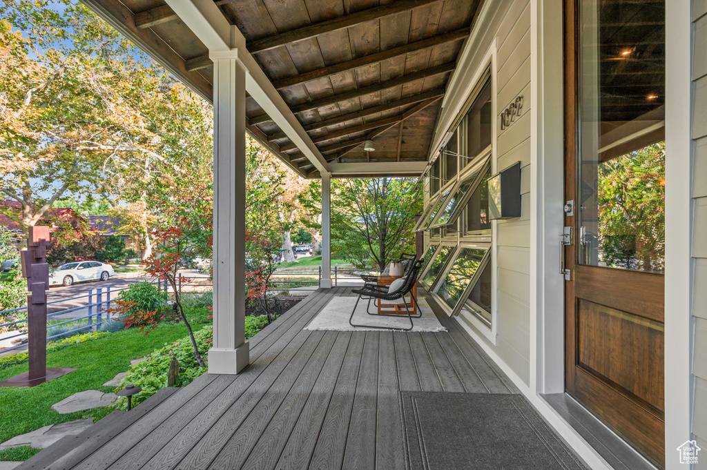 Deck with a yard and covered porch