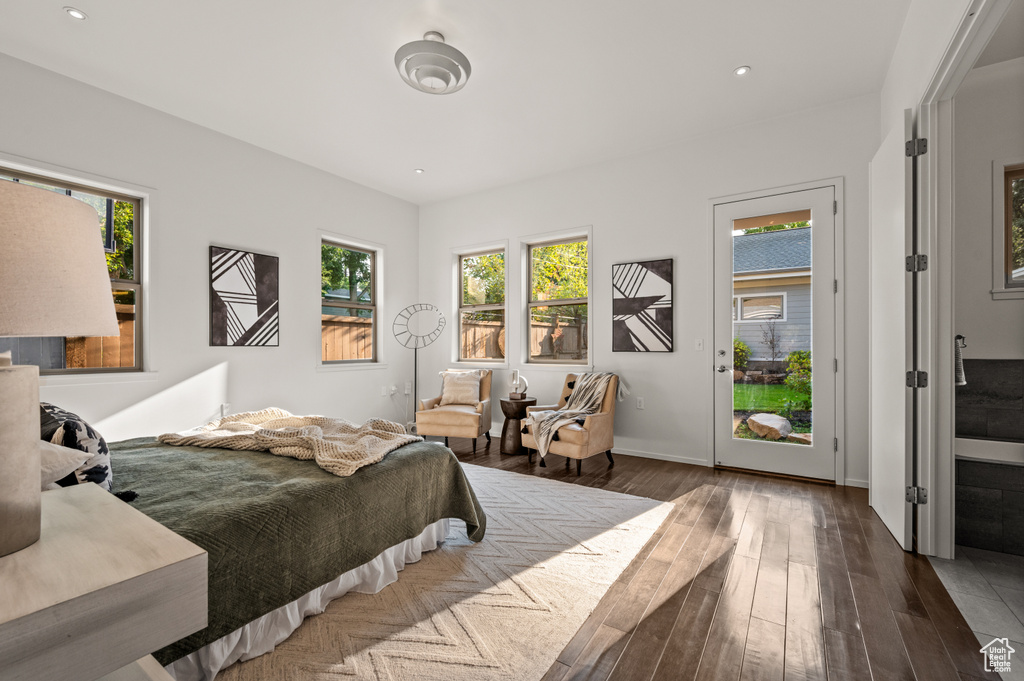 Bedroom with dark hardwood / wood-style floors