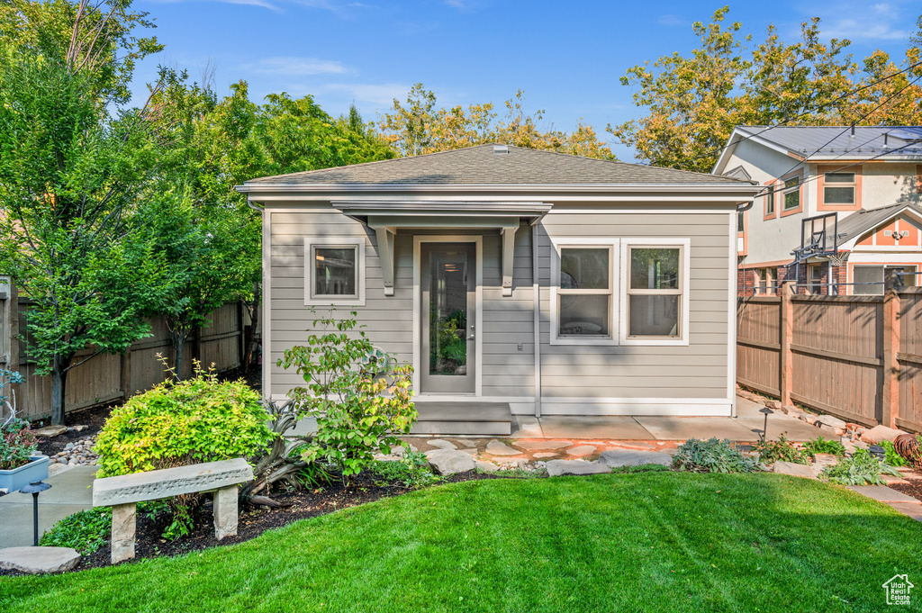 Exterior space featuring a lawn