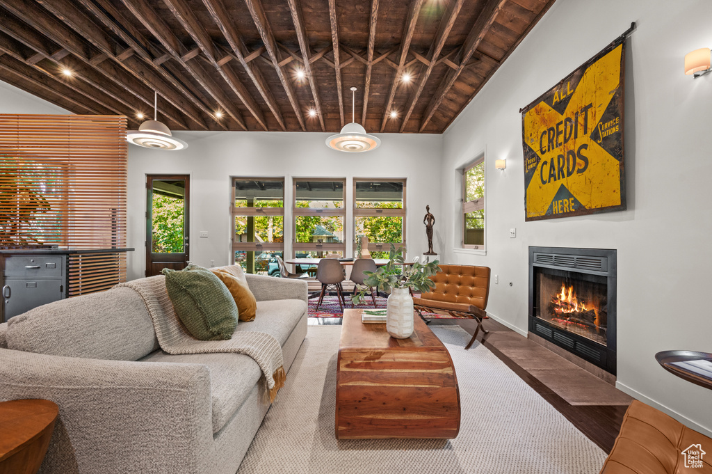 Living room featuring wooden ceiling and hardwood / wood-style flooring