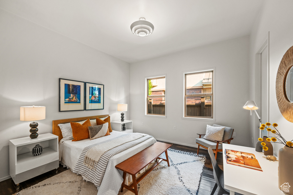 Bedroom with hardwood / wood-style floors