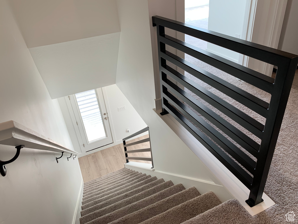 Stairway with hardwood / wood-style flooring