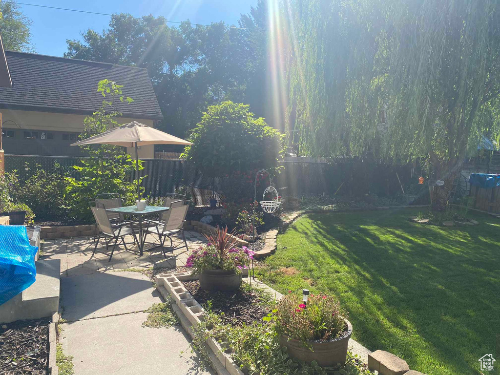 View of yard with a patio