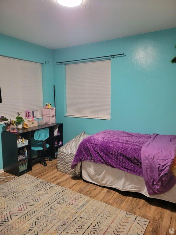 Bedroom featuring hardwood / wood-style flooring