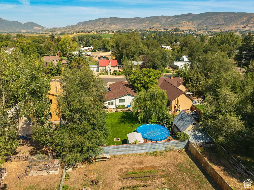 Birds eye view of property with a mountain view