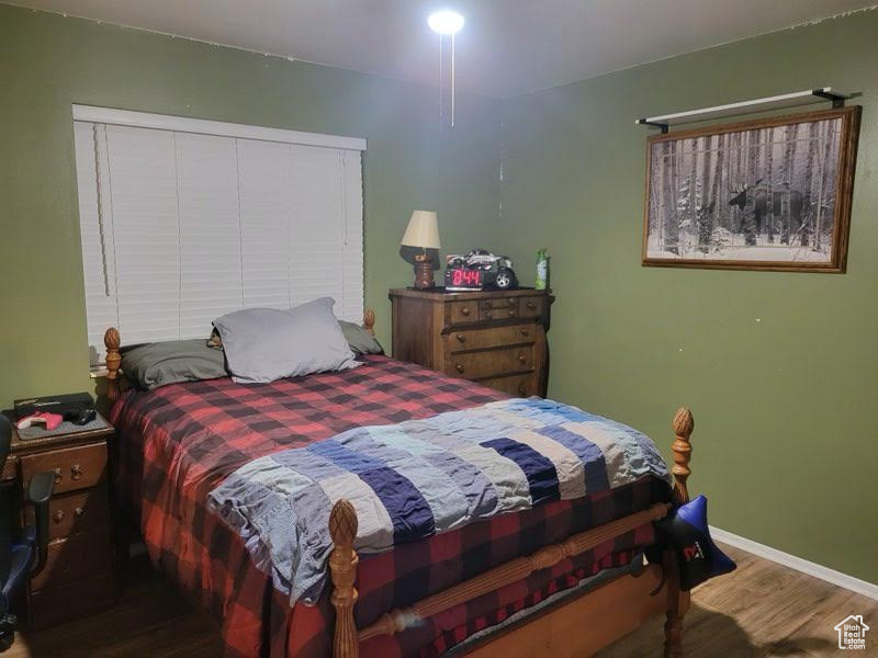 Bedroom featuring hardwood / wood-style flooring