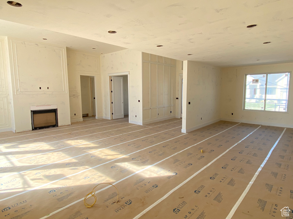 Unfurnished living room featuring a fireplace