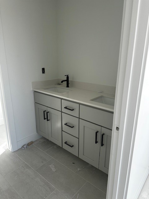 Bathroom featuring vanity and tile patterned floors