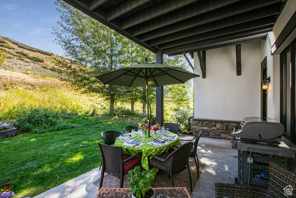 View of patio featuring area for grilling