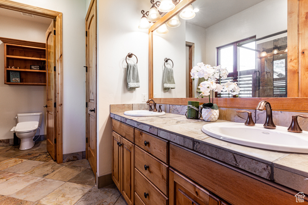 Bathroom with toilet and vanity