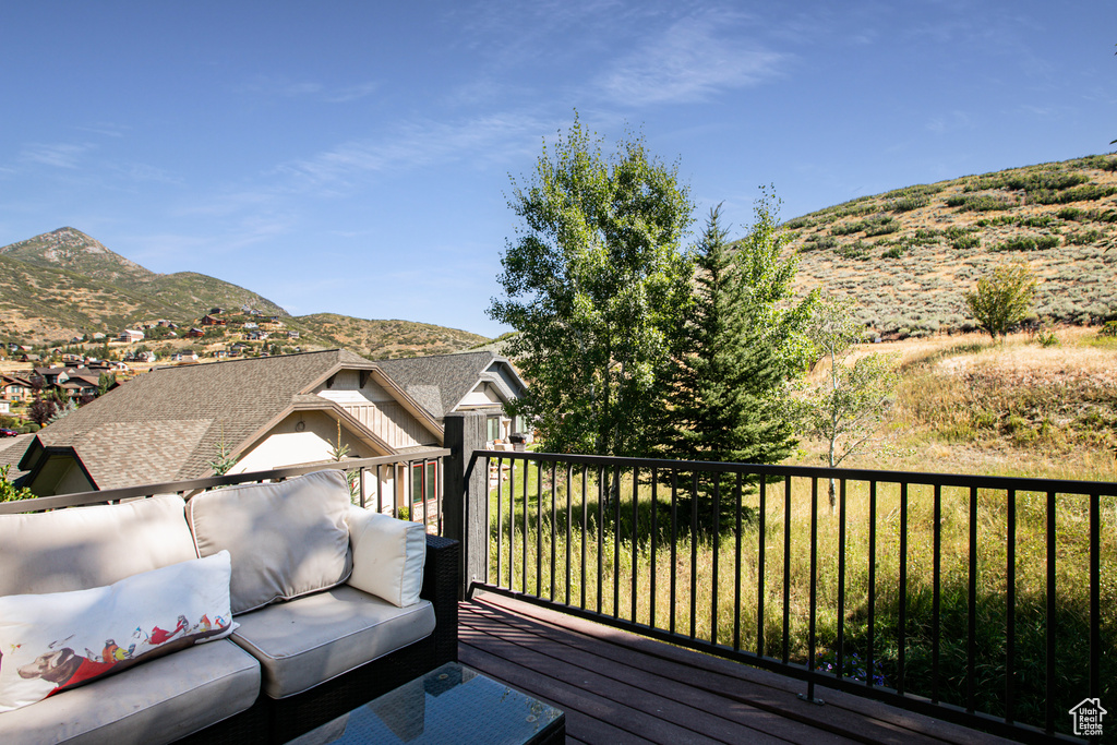 Wooden deck featuring a mountain view