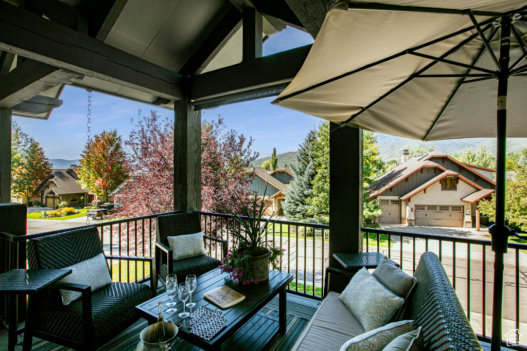 Wooden deck featuring a garage