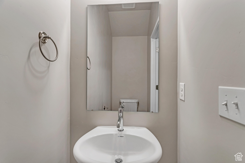 Bathroom featuring toilet and sink