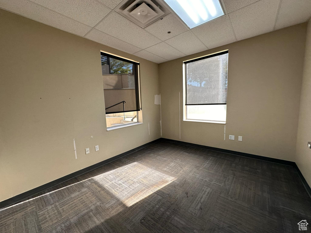 Empty room with a drop ceiling