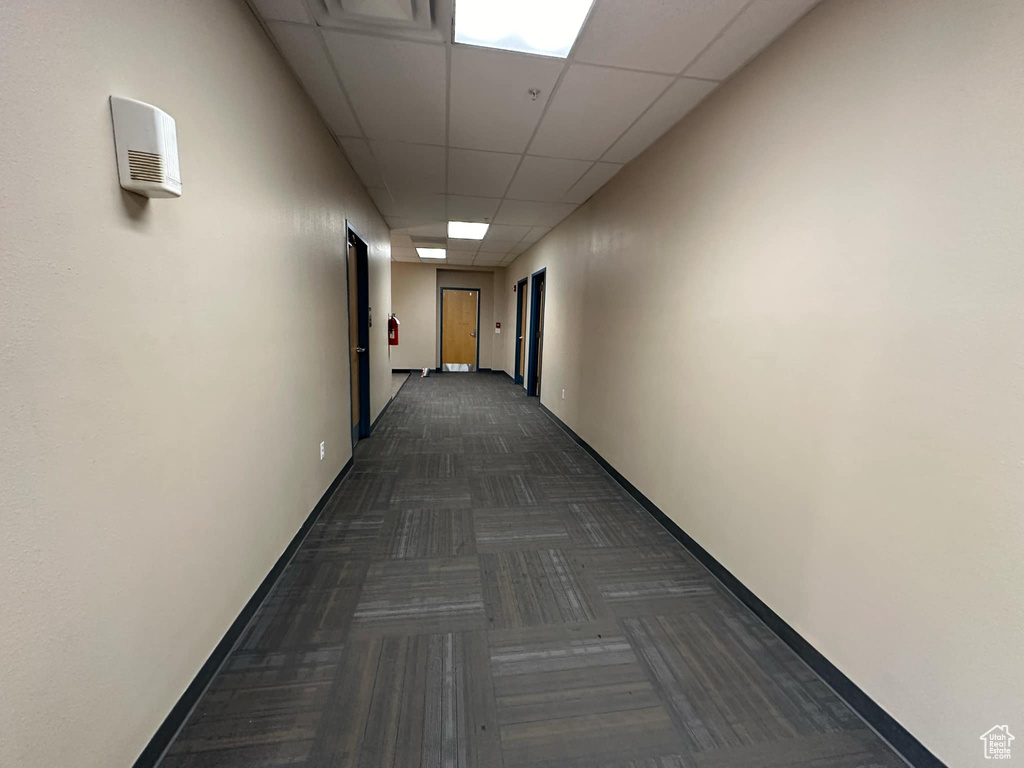 Hall with a paneled ceiling