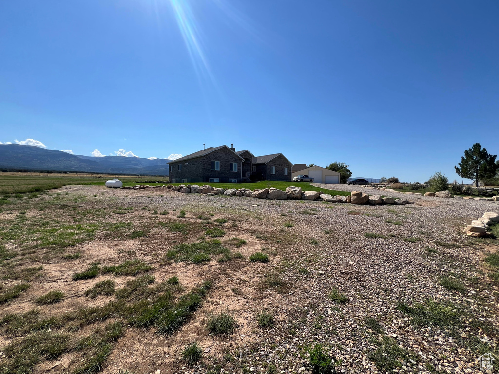 Property view of mountains with a rural view