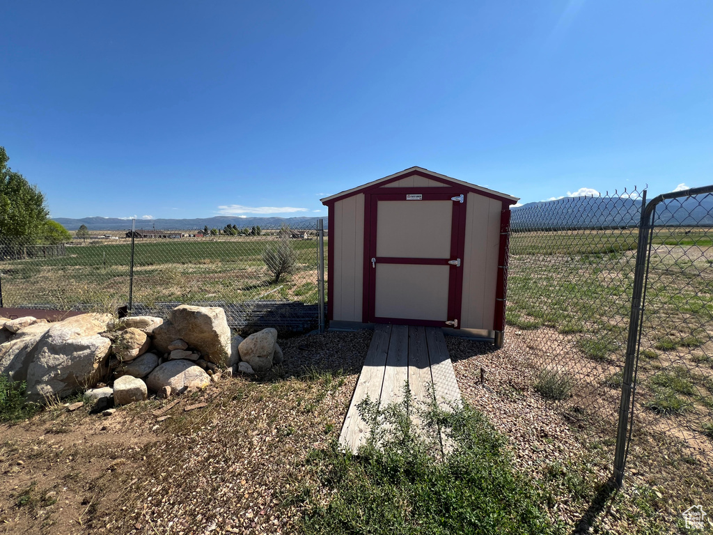 View of outdoor structure with a rural view