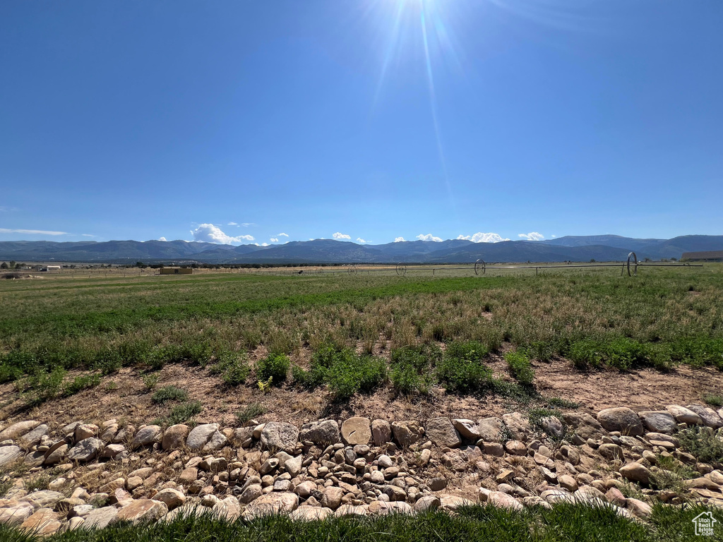 Property view of mountains with a rural view