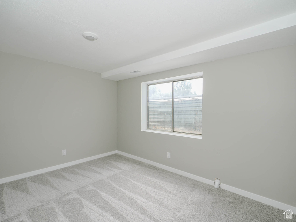 View of carpeted spare room