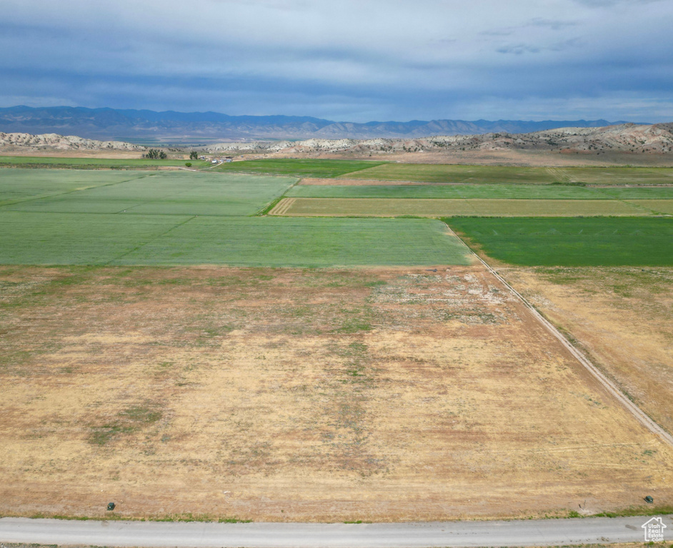 Birds eye view of property with a mountain view and a rural view