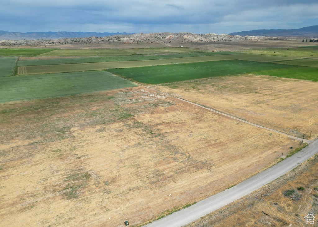 Aerial view featuring a rural view and a mountain view