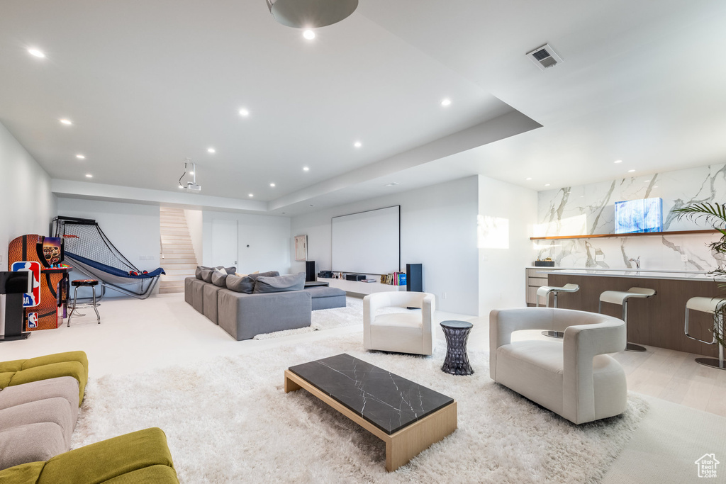 Living room featuring a raised ceiling