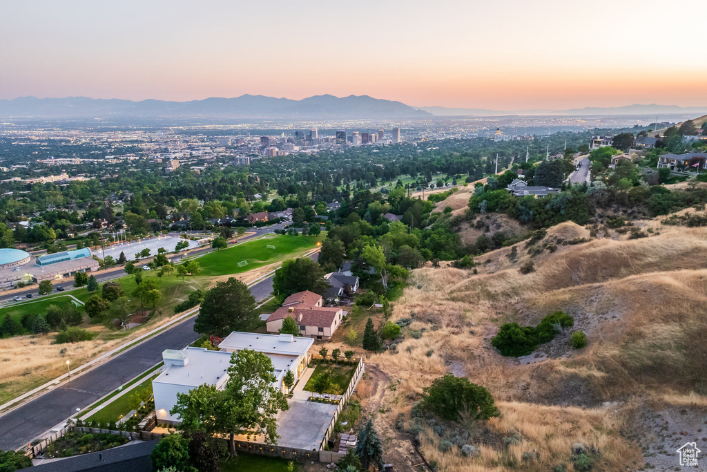 Aerial view at dusk featuring a mountain view