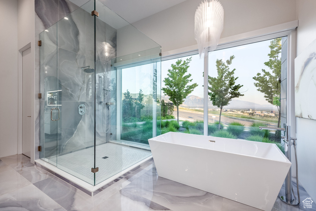 Bathroom featuring plus walk in shower