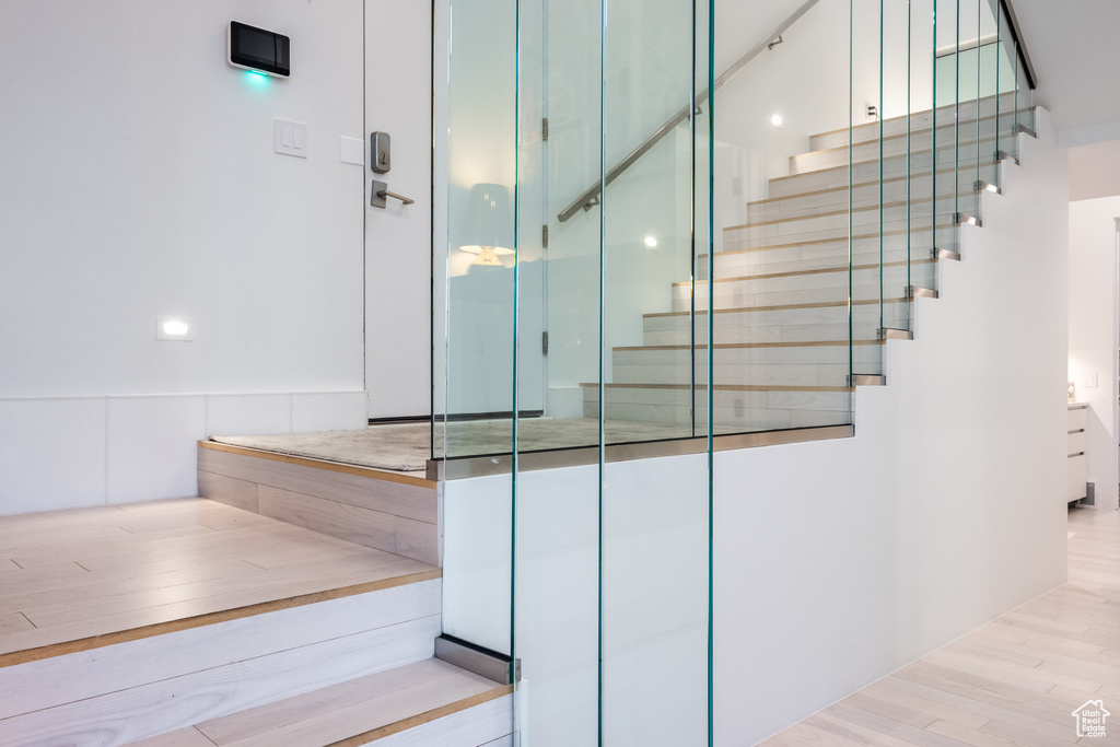 Staircase with hardwood / wood-style flooring