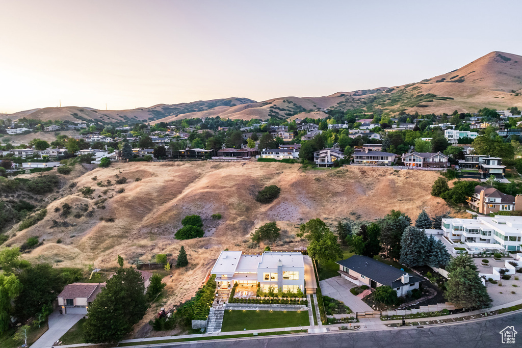 Aerial view at dusk featuring a mountain view