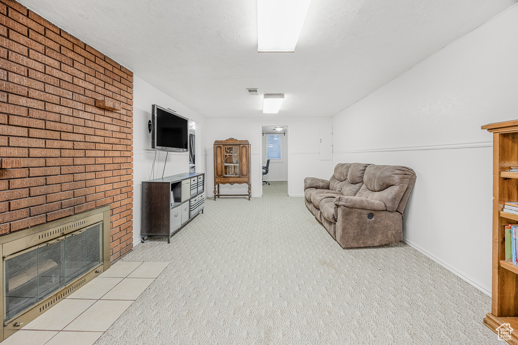 Living room with light carpet and a fireplace