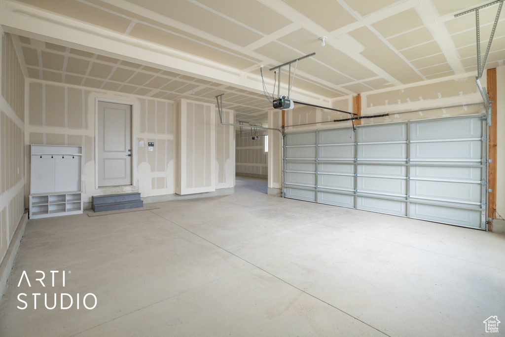 Garage featuring a garage door opener